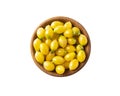 Yellow tomatoes lay on white background. Top view. Cherry tomatoes on a wooden bowl isolation. Baby tomatoes isolated on a white Royalty Free Stock Photo