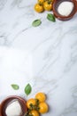 Yellow tomatoes with mozzarella cheese and basil on marble background