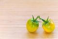 Yellow tomatoes on wooden board Royalty Free Stock Photo