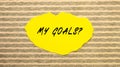 Yellow torn paper with the text MY GOALS on a gray-pink background Royalty Free Stock Photo