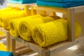 Yellow towels on the shelf in the closet Royalty Free Stock Photo