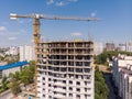 Yellow tower crane and building under construction. aerial view Royalty Free Stock Photo