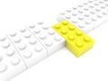 Yellow toy brick out of row Royalty Free Stock Photo