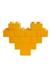 Yellow toy bricks heart on white background