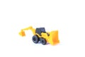 The yellow toy car Bulldozer-Excavator isolated on white background. Children`s backhoe toy model