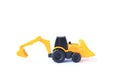 The yellow toy car Bulldozer-Excavator isolated on white background. Children`s backhole toy model Royalty Free Stock Photo