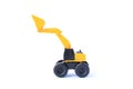 The yellow toy car Excavator isolated on white background. Children`s backhoe toy model Royalty Free Stock Photo