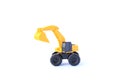 The yellow toy car Excavator isolated on white background. Children`s backhoe toy model Royalty Free Stock Photo