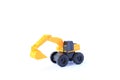 The yellow toy car Excavator isolated on white background. Children`s backhoe toy model Royalty Free Stock Photo