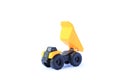 The yellow toy car Heavy truck isolated on white background. Children`s tractor toy. Wheel loader construction car model Royalty Free Stock Photo