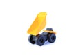 The yellow toy car Heavy truck isolated on white background. Children`s tractor toy. Wheel loader construction car model Royalty Free Stock Photo