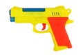 A yellow toy gun. On a white background, isolated Royalty Free Stock Photo