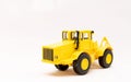 Yellow toy tractor realistic miniature