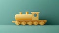 A yellow toy train on a teal background Royalty Free Stock Photo