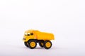 Yellow toy truck isolated on white