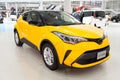 Yellow Toyota C-HR IZOA. Toyota City Showcase Mega Web Palette Town