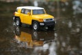 Yellow Toyota PJ cruiser car toy with selective focus