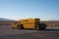 Yellow tractor hauling a trailer with a propane tank. Caterpillar DX10 1N Series 4x2. Is aba