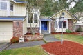 Yellow traditional Northwest house with red brick. Royalty Free Stock Photo