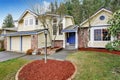 Yellow traditional Northwest house with red brick. Royalty Free Stock Photo