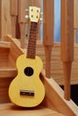 Yellow traditional soprano ukulele guitar