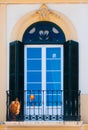 Colorful traditional window in Spain with stucco decoration