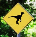 Yellow traffic label with dinosaur pictogram