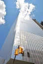 Yellow traffic light against modern shining reflective skyscraper Four World Trade Center building, Liberty St, Manhattan New York Royalty Free Stock Photo