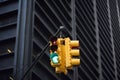 Yellow Traffic Light on background of skyscrapers, Manhattan, New York, USA. Green stop signal