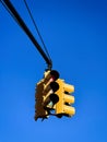 Yellow traffic light on a blue sky background Royalty Free Stock Photo