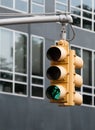 Yellow Traffic light with green sigh flashing