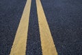 Yellow traffic lines marking on asphalt road