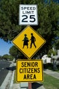 Yellow traffic sign that says Senior Citizens Area with graphic of senior citizens walking and 25 mph speed limit