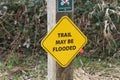 A yellow trail may flood sign