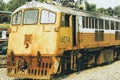 Yellow train, Thailand train. Procession yellow Train led by diesel electric locomotive on the tracks from Thailand