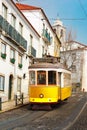 Yellow 28 tram in Alfama, Lisbon, Portugal Royalty Free Stock Photo