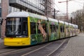 Yellow tram in Berlin in motion