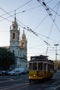 Yellow tram in front of Basilica of Estrela in the evening. Lisbon, Portugal Royalty Free Stock Photo