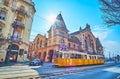 The yellow tram in front of Central Market Hall, Budapest, Hungary