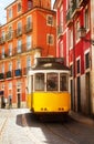 Tram on narrow street of Alfama, Lisbon