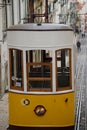 Yellow tram parked on a steep hill