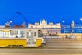 Yellow tram speeding up in Budapest in front of Hungarian Parliament at night Royalty Free Stock Photo