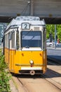 Yellow tram under Elisabeth Bridge in Budapest