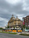 Yellow trams stand on Deak Ferenc Square near Anker house. Budapest