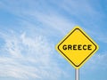 Yellow transportation sign with word greece on blue sky background Royalty Free Stock Photo