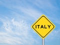 Yellow transportation sign with word italy on blue sky background Royalty Free Stock Photo