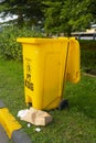 Yellow trash with bag from paper