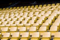 yellow tribunes seats tribune sport stadium empty outdoor arena concept fans chairs audience cultural environment concept color