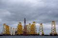 Tripods for supporting wind turbines awaiting relocation in the North Sea, photographed at port in Cromarty, Scotland UK. Royalty Free Stock Photo