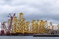 Tripods for supporting wind turbines awaiting relocation in the North Sea, photographed at port in Cromarty, Scotland UK. Royalty Free Stock Photo